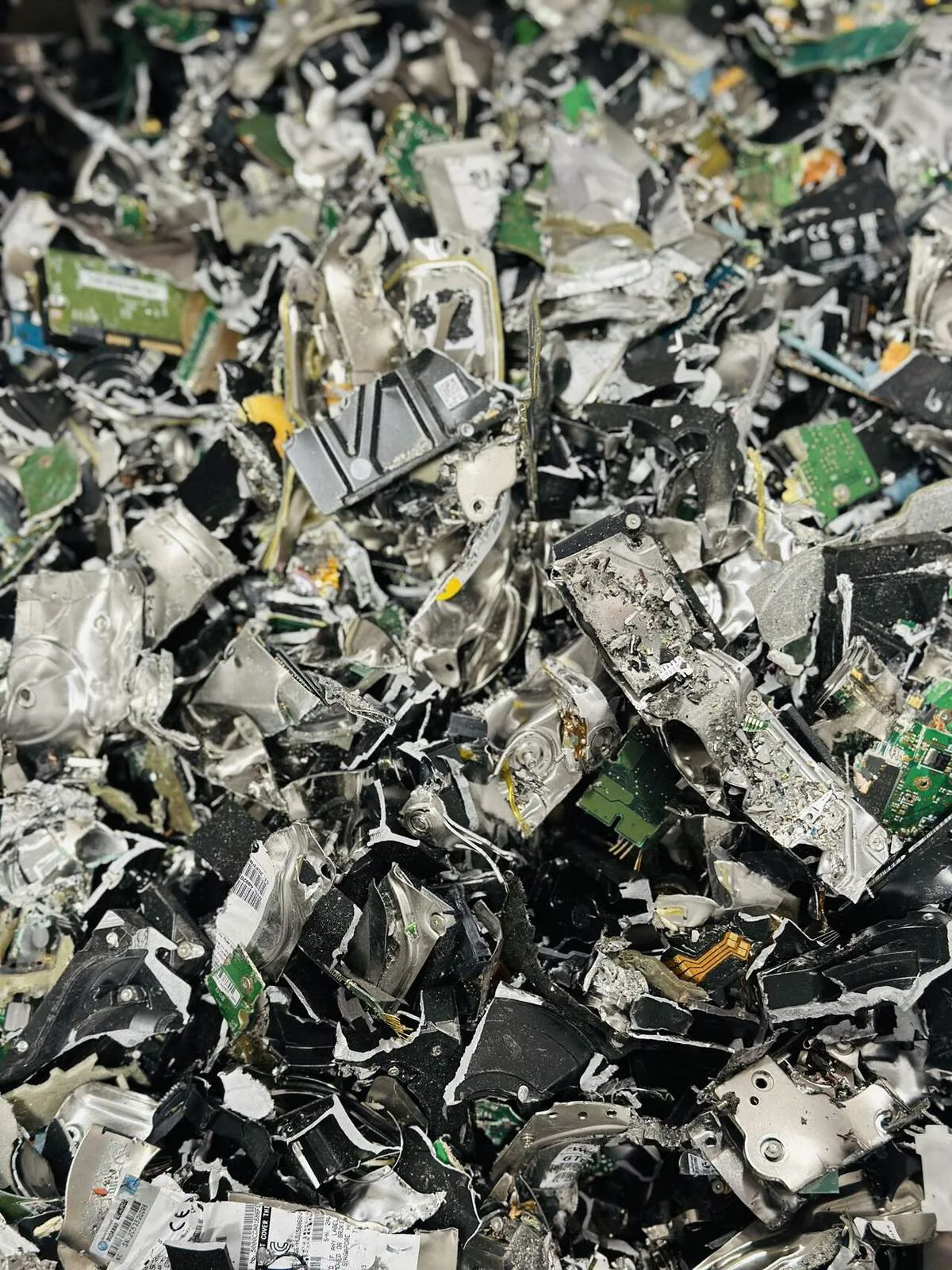 Shredded hard drive housings and circuit boards